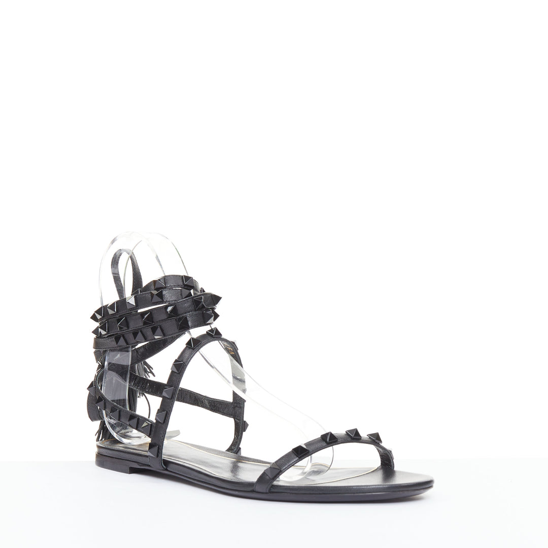 VALENTINO Rockstud black leather wraparound lace up tassel gladiator flats EU38