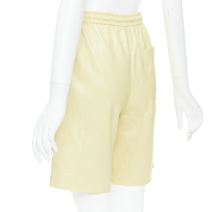 NANUSHKA  Munira Okobor butter yellow vegan leather drawstring bermuda shorts XS