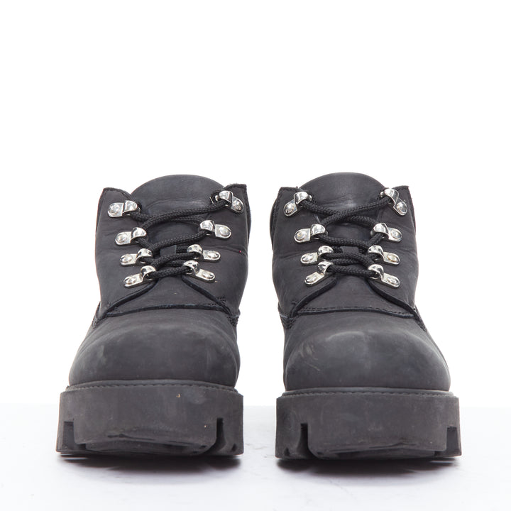 Female mannequin wearing Acne Studios Tinnie Black Leather Women Boots in Size EU38 | Available at JHROP