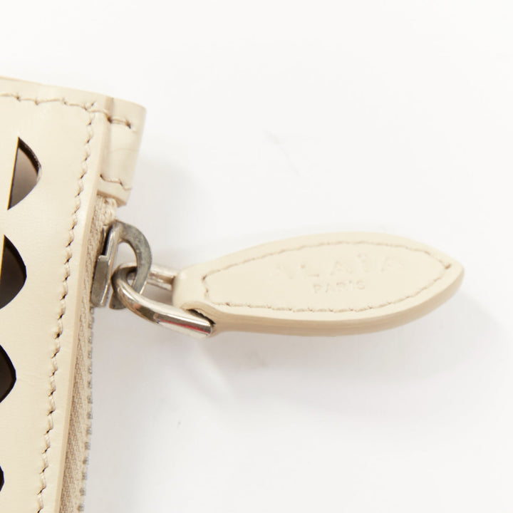 ALAIA Vienne laser cut tan beige neutral calfskin flat zip pouch clutch bag
