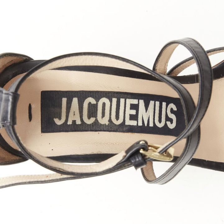 JACQUEMUS architectural wood block gold ring black strappy heel EU36