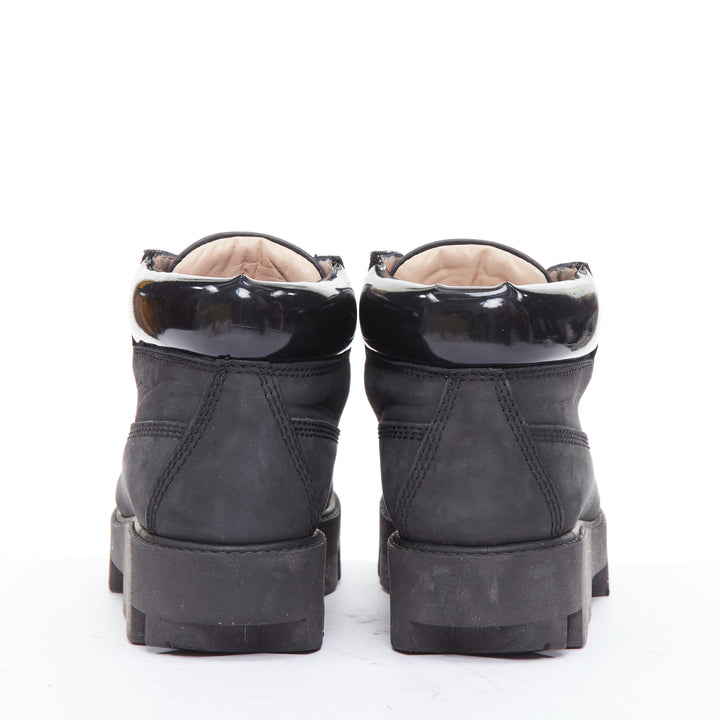 Female mannequin wearing Acne Studios Tinnie Black Leather Women Boots in Size EU38 | Available at JHROP