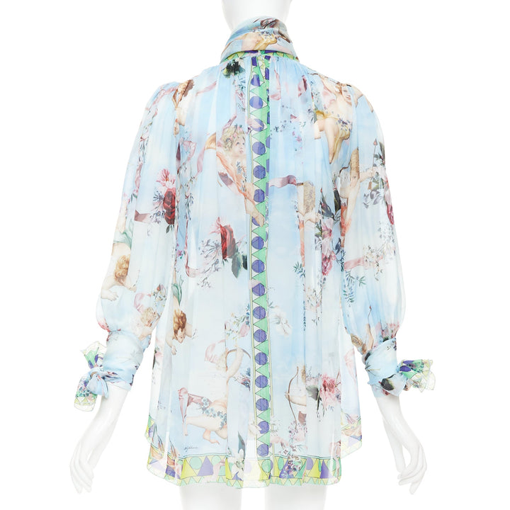 DOLCE GABBANA  100% silk blue Cherub Cupids print pussybow sheer blouse IT40 S
