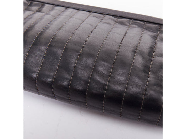 CHANEL 2005 Mademoiselle Ligne black vertical quilt lambskin kisslock clutch bag