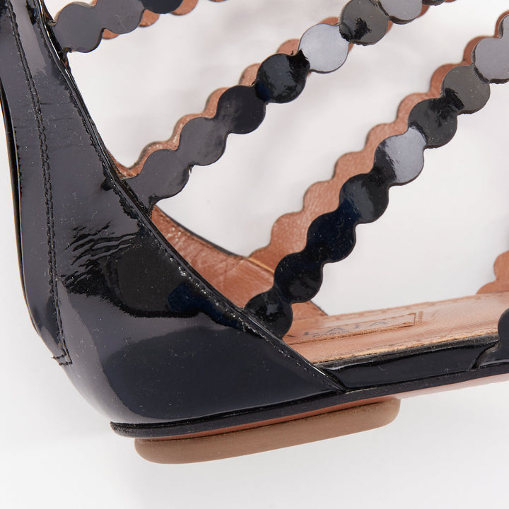 ALAIA black patent leather laser cut scalloped cage gladiator flat sandals EU36