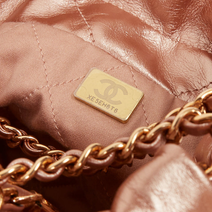 CHANEL 2023 Runway 22 Mini rose gold metallic calfskin leather drawstring bag