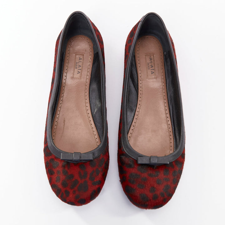 ALAIA red calf hair leopard print black leather trim ballet flats EU37.5