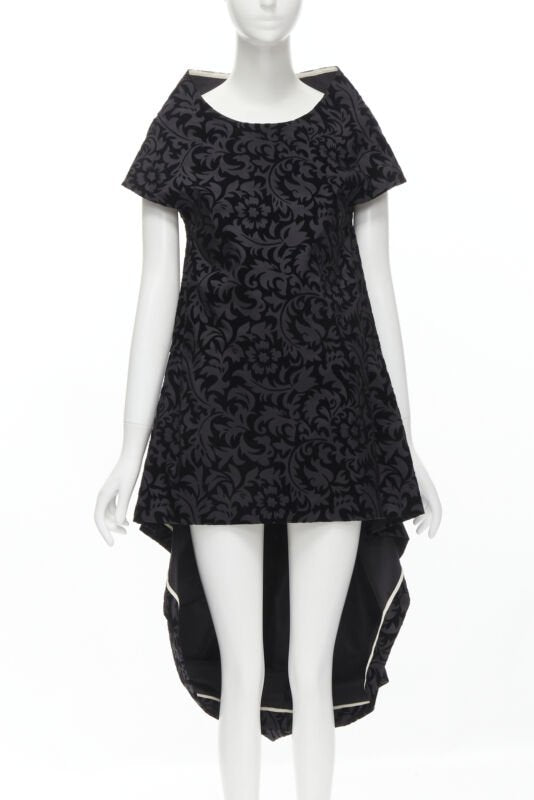 Female mannequin wearing Comme Des Garcons by Rei Kawakubo 1996 Runway Black Cotton Women Cocktail Dresses in Size  M | Available at JHROP