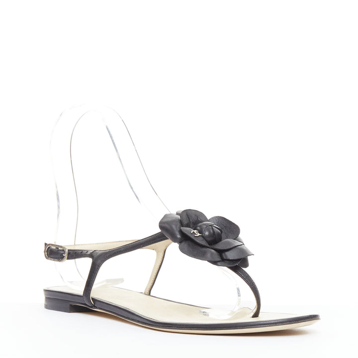 CHANEL black leather silver CC logo camellia flat T strap sandals EU37.5