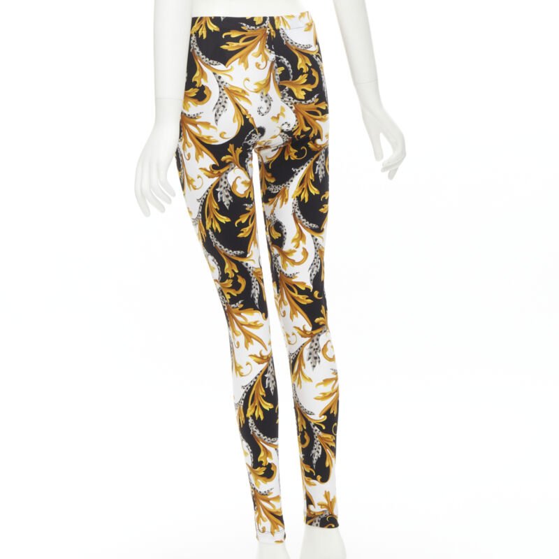 Female mannequin wearing Versace by Donatella Versace Barocco Acanthus Gold Polyamide Women Pants in Size IT42 | Available at JHROP