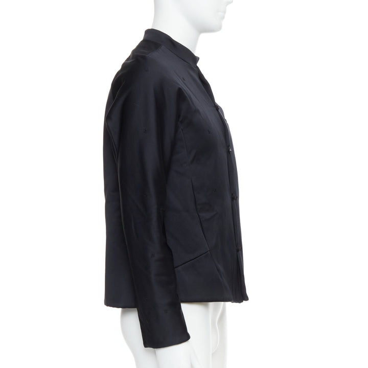 Male mannequin wearing Shiatzy Chen Black Cotton Men Coat in Size EU48 | Available at JHROP