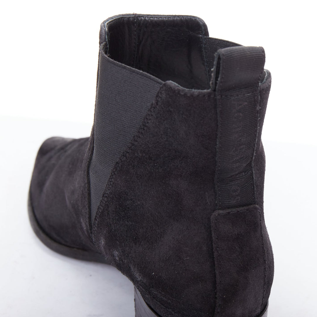 Female mannequin wearing Acne Studios Jensen Black Suede Women Boots in Size EU38 | Available at JHROP