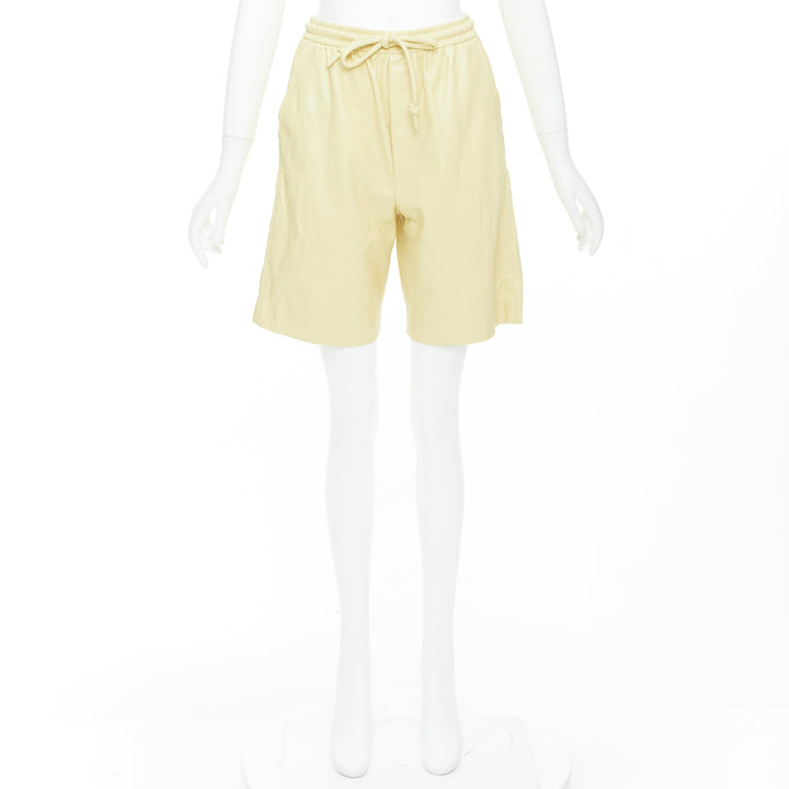 NANUSHKA  Munira Okobor butter yellow vegan leather drawstring bermuda shorts XS