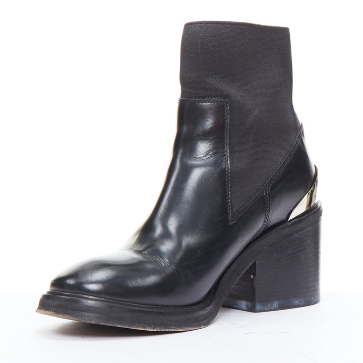 Female mannequin wearing Acne Studios Dion Black Leather Women Boots in Size EU38 | Available at JHROP