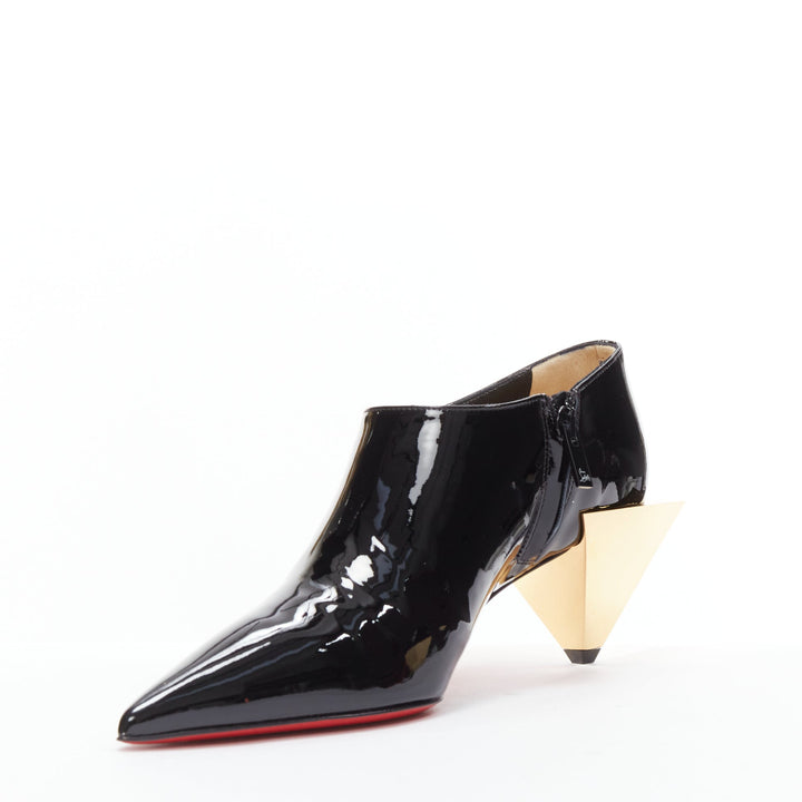 CHRISTIAN LOUBOUTIN Xilobooties 55 gold pyramid heel black patent pump EU38