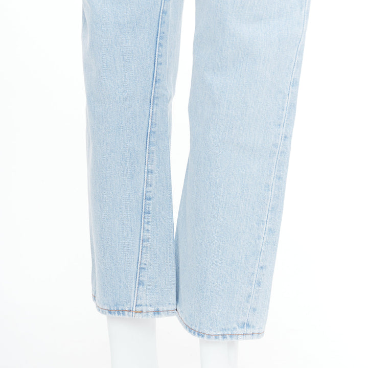 TOTEME Twisted Seam light blue washed denim asymmetric jeans 27"