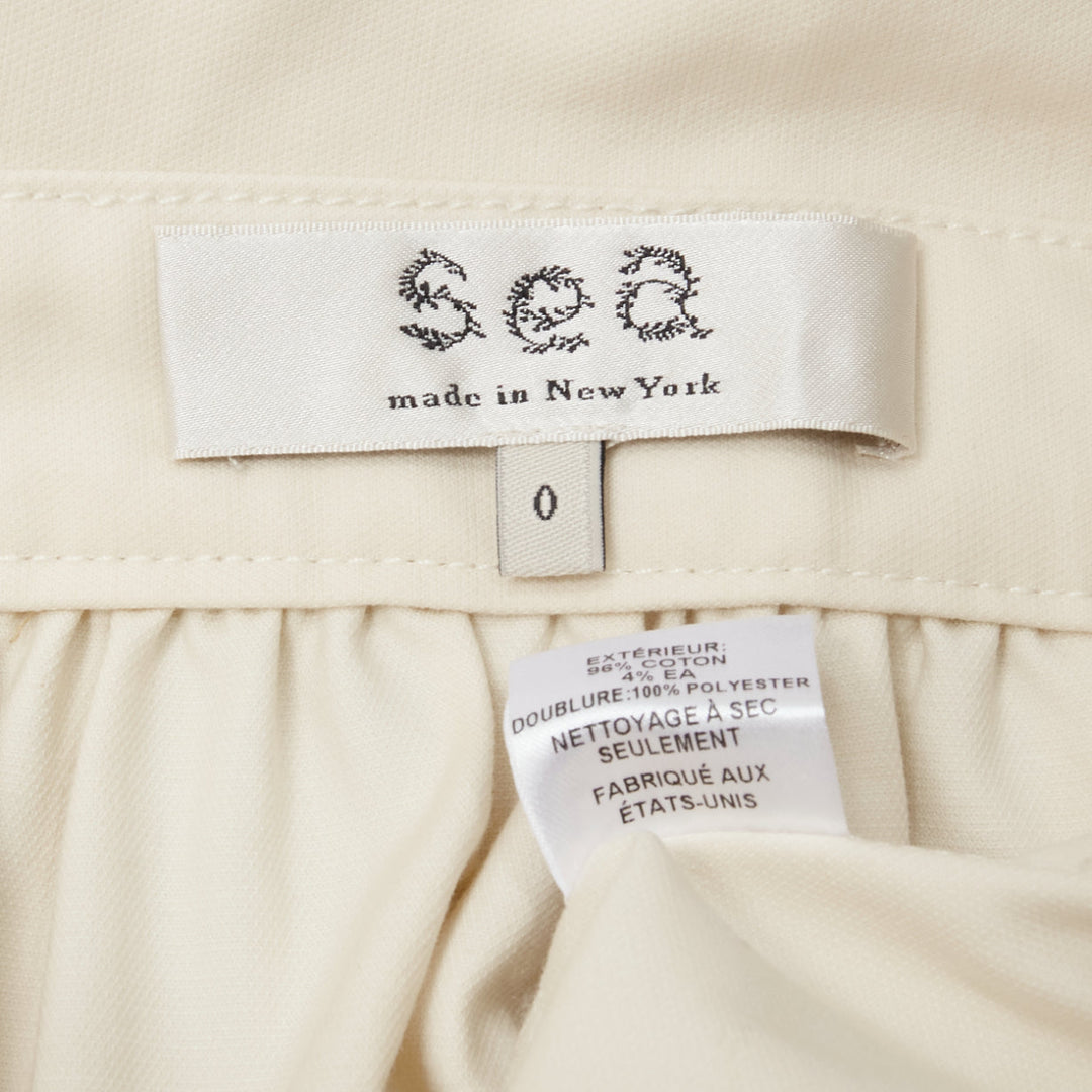 SEA NEW YORK cream cotton peplum pocket flap belt waist A-line skirt US0 XS