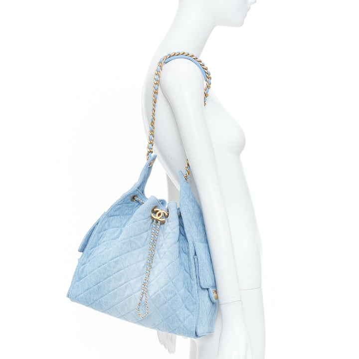 CHANEL Runway 25 Small light blue washed denim gold hardware bucket hobo bag