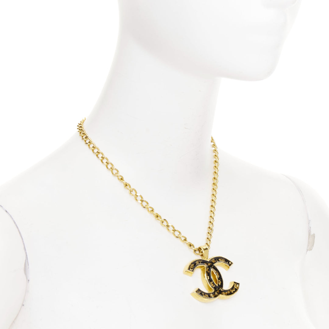 CHANEL 2023 Monte Carlo gold black glitter foil resin CC logo pendant  necklace