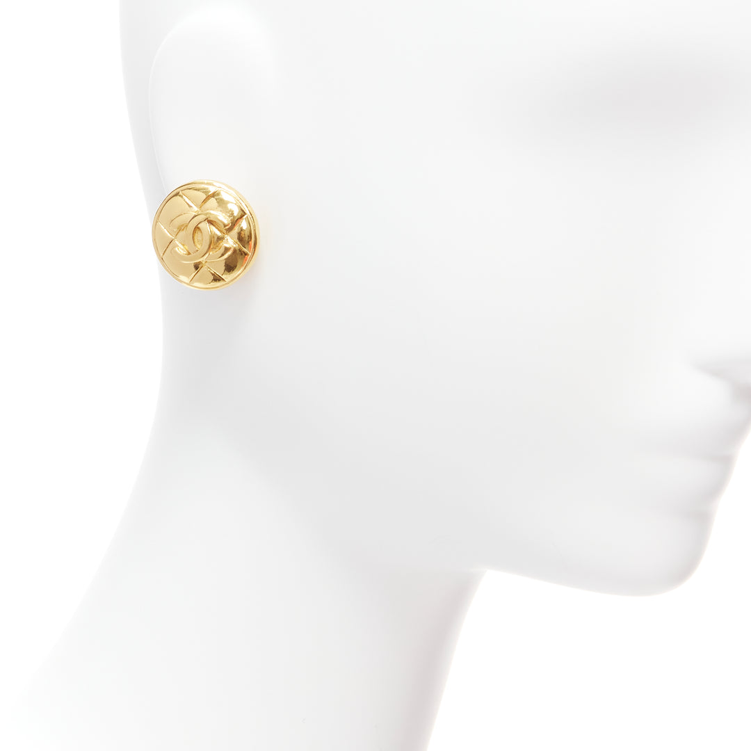 CHANEL gold tone diamond quilted CC logo medallion coin clip on earring